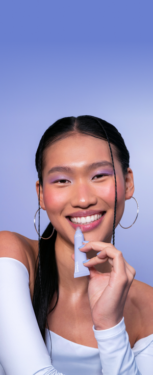 model applying lip balm