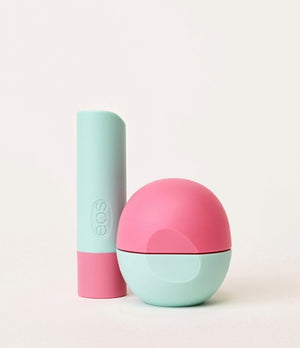 Two EOS lip products, one pink and one light blue, on a white background.