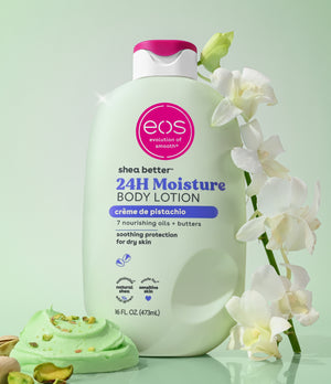 EOS shea butter 24H moisture body lotion with a green dessert and white flowers on a light green background