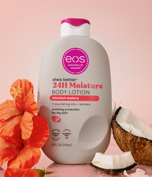 EOS 24H Moisture body lotion bottle with coconut and flower on a pink background