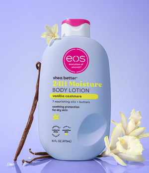 eos shea butter 24H Moisture body lotion bottle with vanilla beans and flowers on a purple background