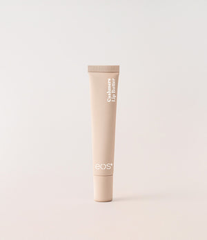 Tube of eos lip balm on a light beige background