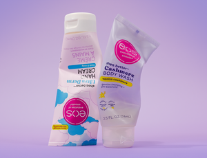 Two bottles of eos products on a purple background