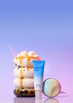 eos lip balm tube and container with a colorful dessert on a purple background