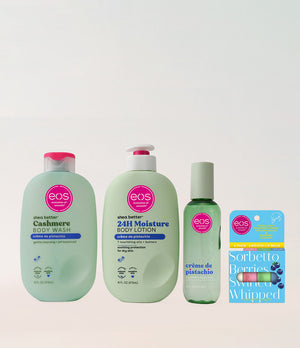 Collection of EOS products including body wash, lotion, and lip balm on a light gray background