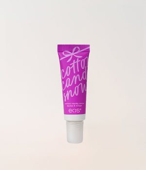 A squeeze tube of EOS Cotton Candy Mint lip balm, featuring a bright magenta purple tube with white text and a white cap, centered against a light off-white background.