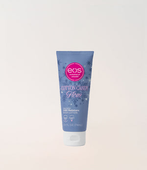 A squeeze tube of EOS Cotton Candy Body Lotion in a light blue color with a white cap, set against a plain off-white background.