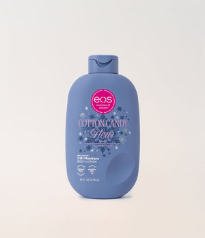 A bottle of EOS Cotton Candy Moisturizing Body Lotion in a dusty blue bottle with a pink and white label, centered on a light beige background.