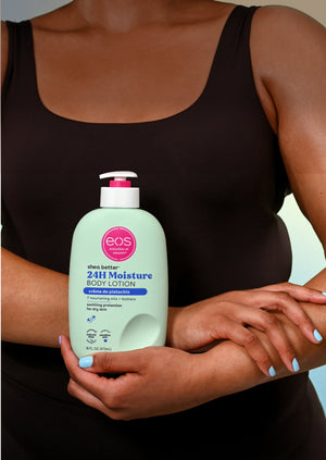 Person holding an eos 24H Moisture body lotion bottle