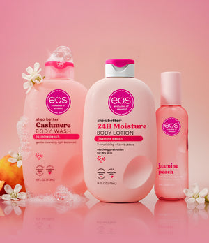 Three eos products on a pink background with flowers and fruit.