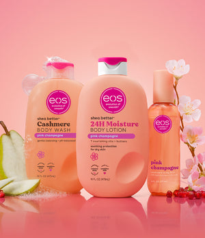 eos shea butter products including body wash, lotion, and hand sanitizer on a pink background with cherry blossoms.