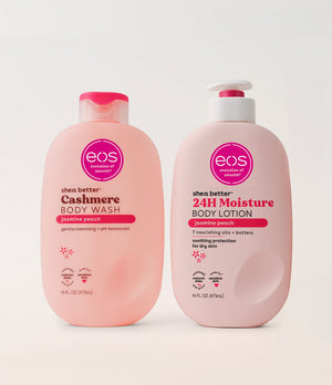 Two bottles of eos shea butter body wash and lotion on a white background