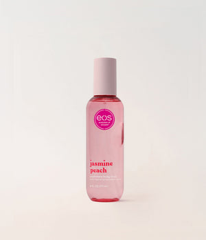 EOS Jasmine Peach body mist bottle on a light pink background