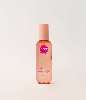 EOS Pink Champagne body mist bottle on a light gray background