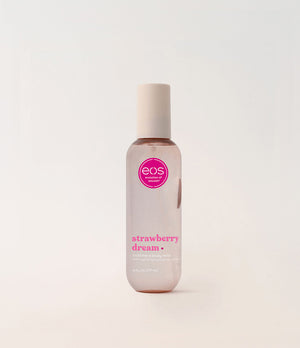 EOS Strawberry Dream body mist bottle on a light beige background