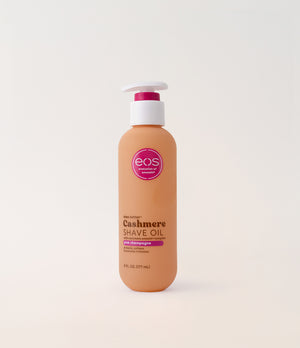 Bottle of eos Cashmere Shave Oil on a light pink background