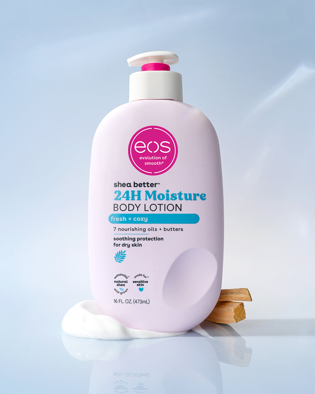 Pink bottle of eos 24H Moisture Body Lotion on a light blue background