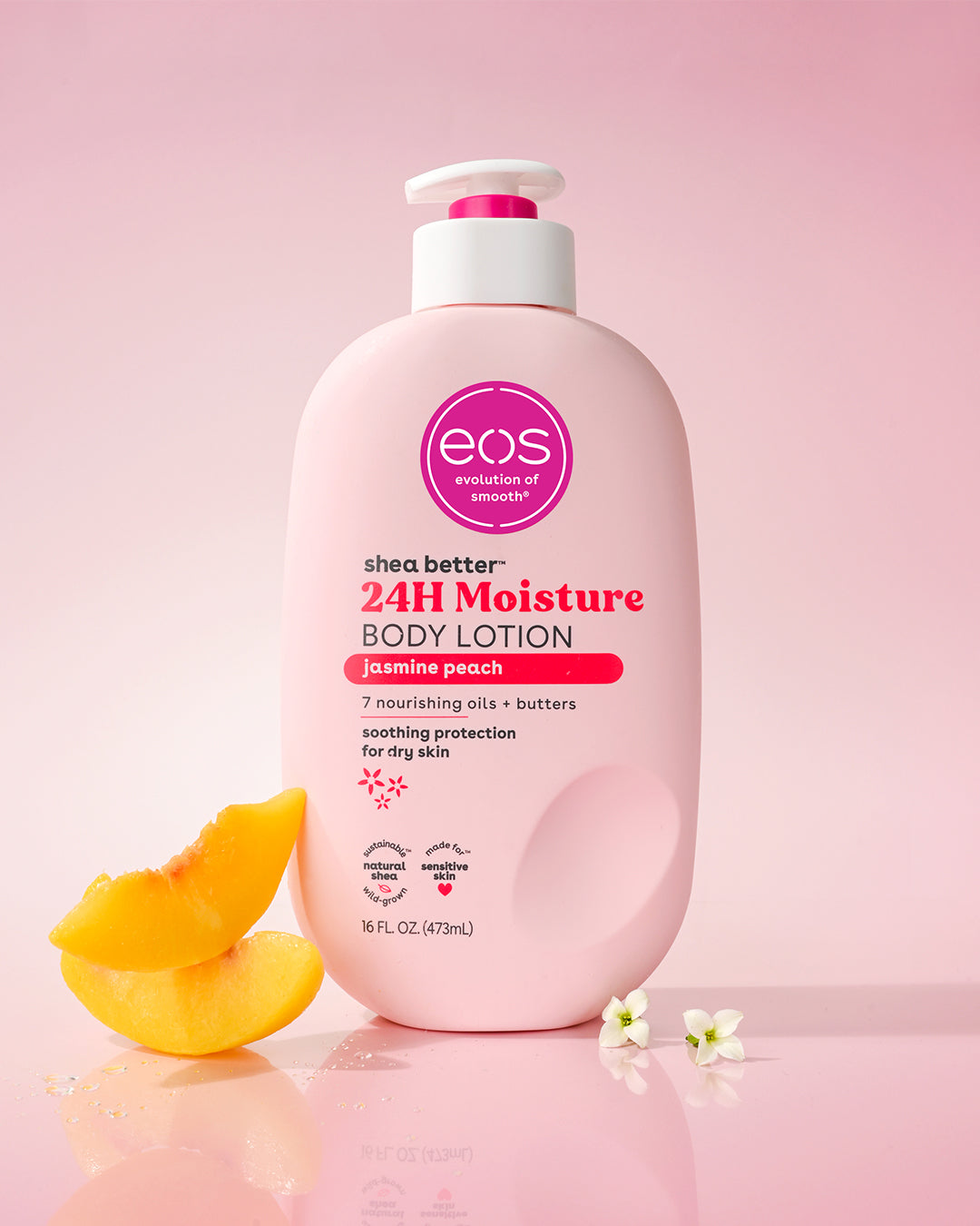 EOS 24H Moisture Body Lotion bottle with peach slices on a pink background